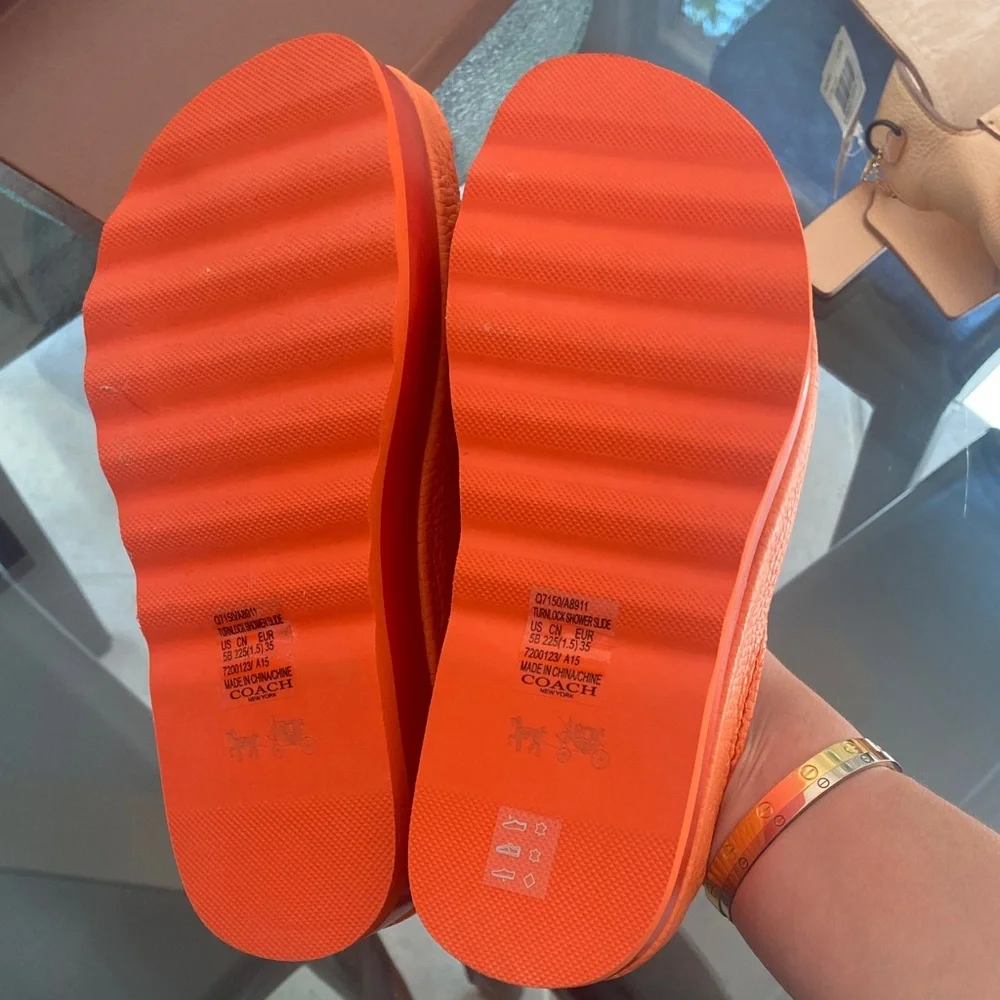 Coach Orange Leather Slide Mules with Turn-Lock Accent